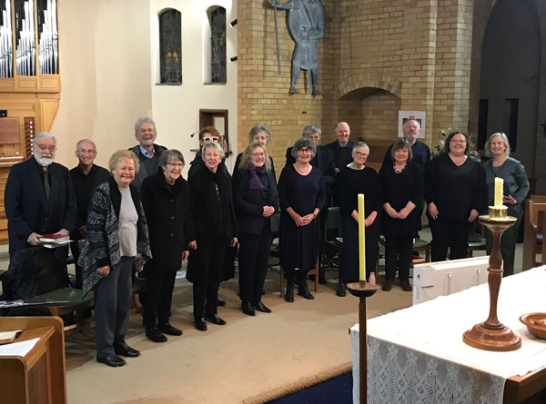 Choir members smiling at the camera