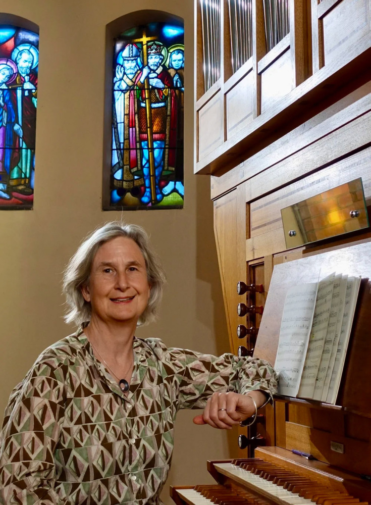 Elizabeth-Anne Nixon sitting at the St Oswald's organ