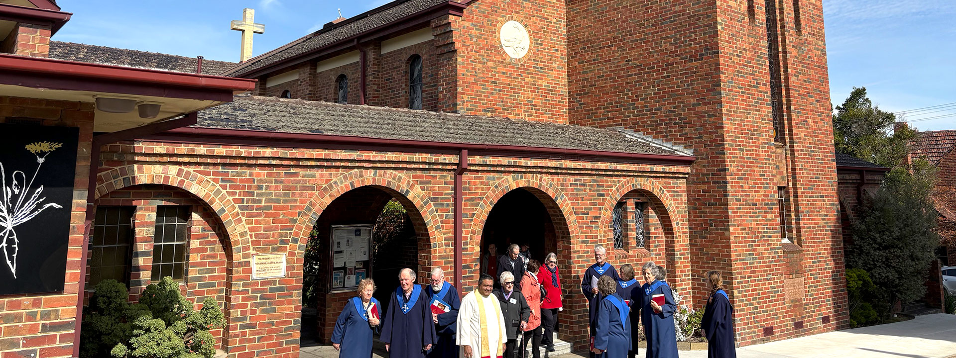 Parishioners standing outside St Oswald's Church